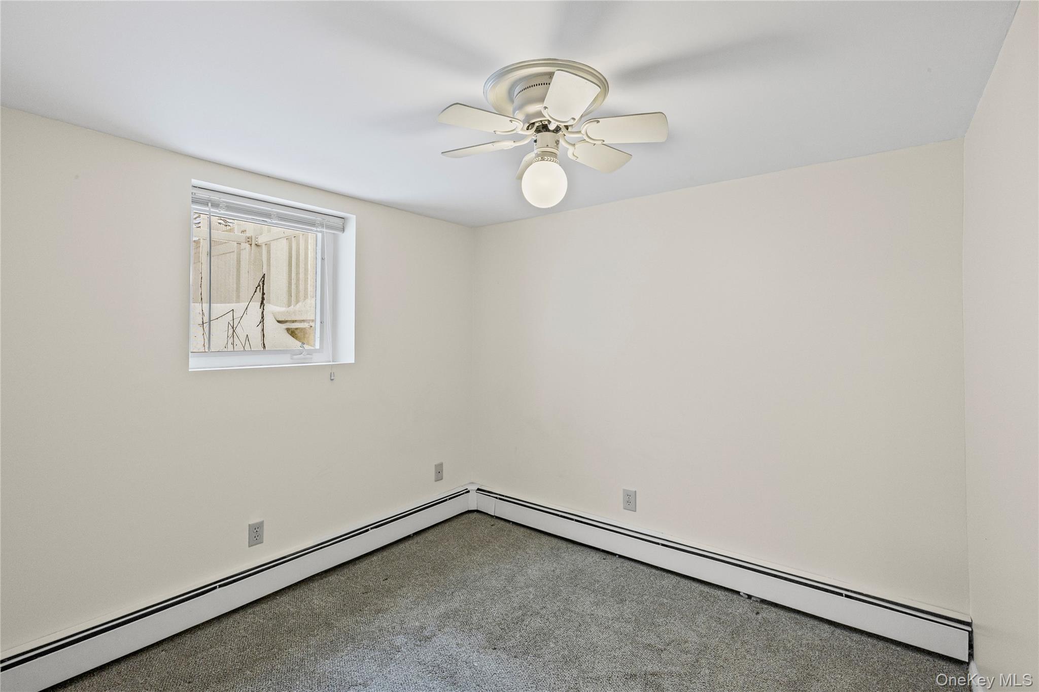 3 Brenner Road Coram, NY 11727 - Photo 36 of 41 a view of an empty room with a fan