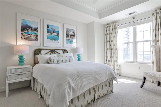 a bedroom with double bed and a window