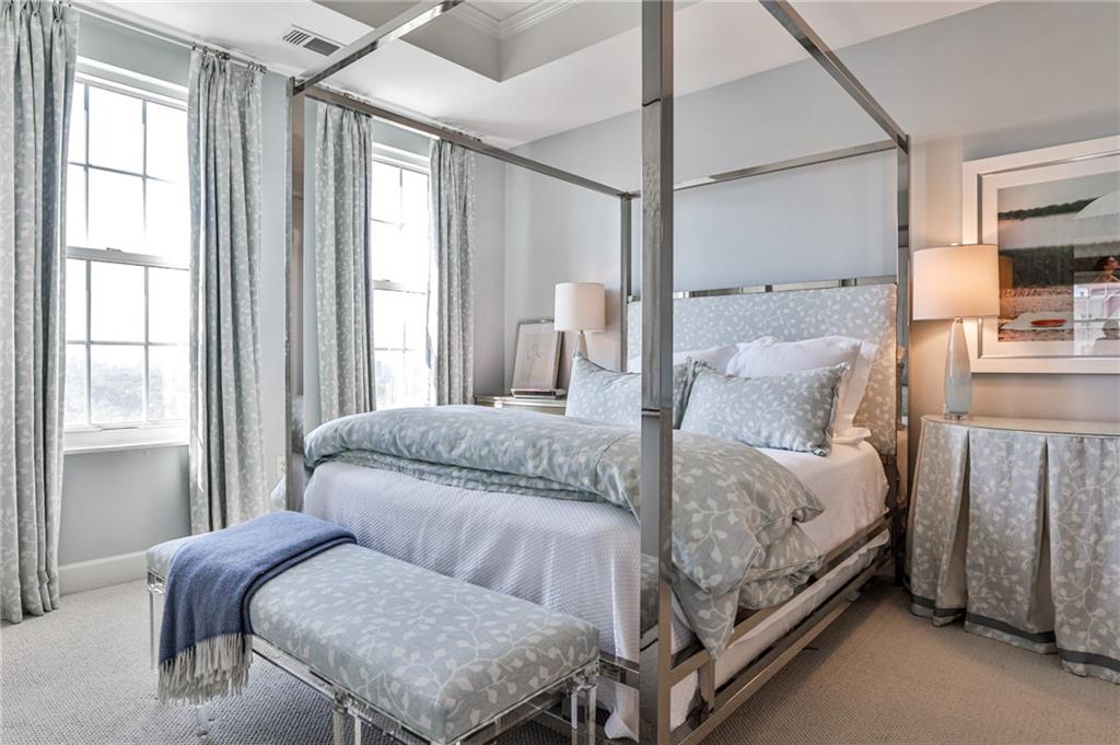325 East Paces Ferry Road Northeast, Unit 1105 Atlanta, GA 30305 - Photo 12 of 36 a bedroom with a bed and a window