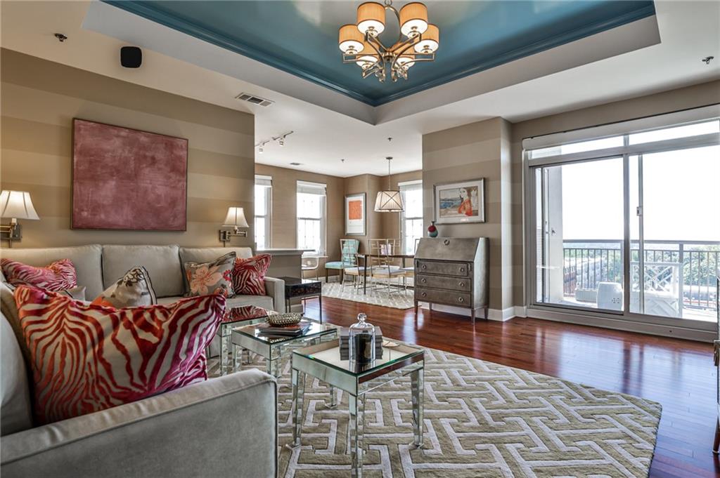 325 East Paces Ferry Road Northeast, Unit 1105 Atlanta, GA 30305 - Photo 18 of 36 a living room with furniture large window and a chandelier