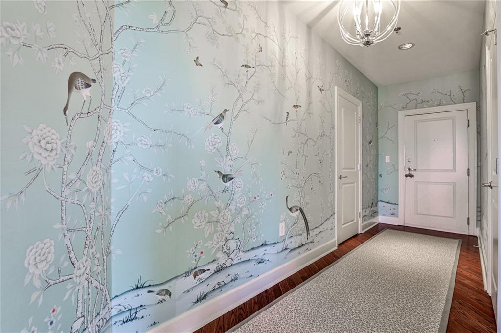 325 East Paces Ferry Road Northeast, Unit 1105 Atlanta, GA 30305 - Photo 4 of 36 a view of a bathroom shower and a sink