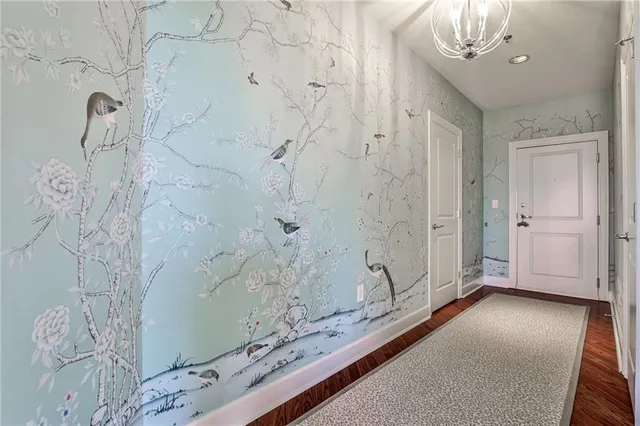 a view of a bathroom shower and a sink