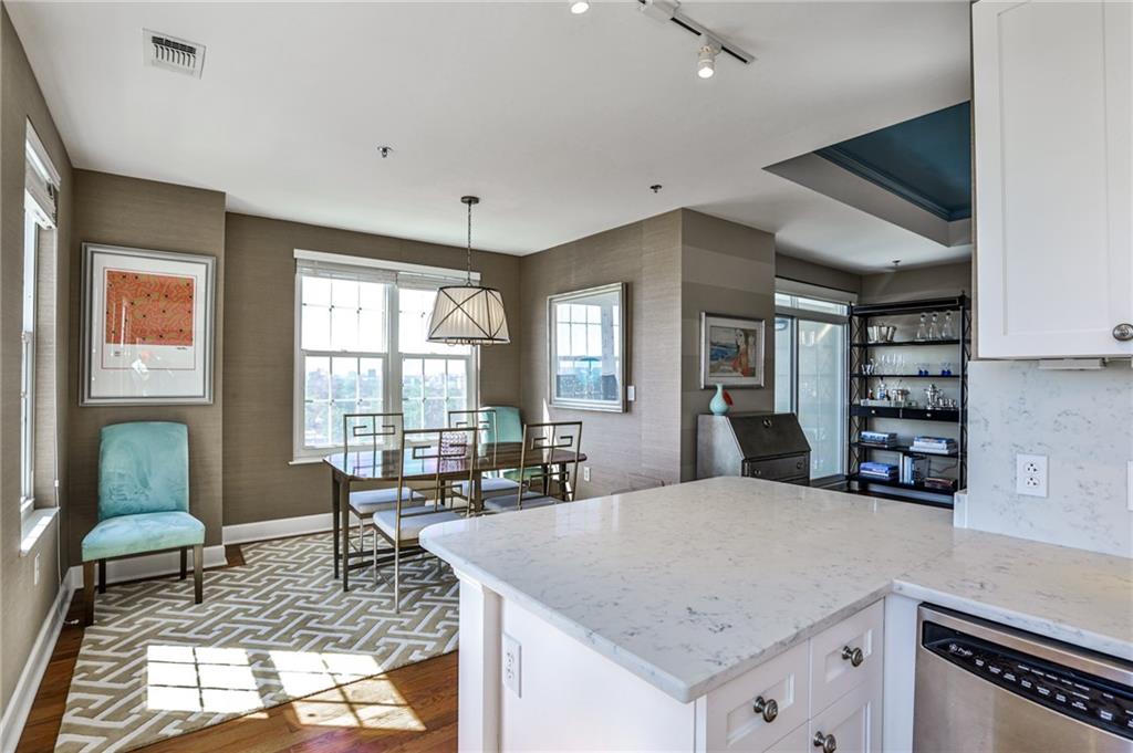 325 East Paces Ferry Road Northeast, Unit 1105 Atlanta, GA 30305 - Photo 8 of 36 a living room with furniture and window