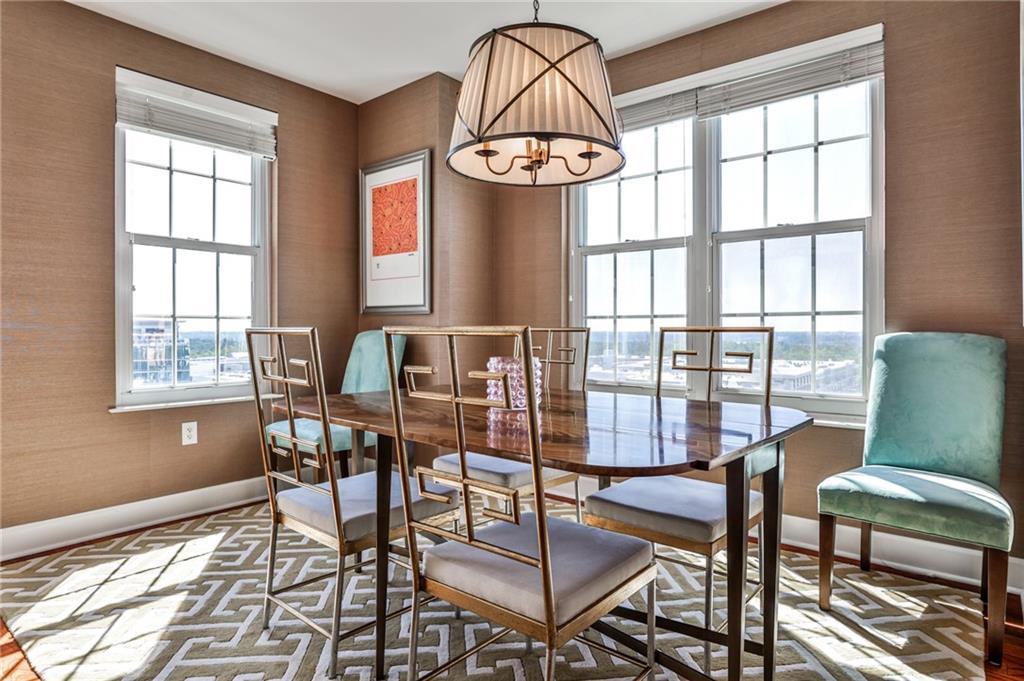 325 East Paces Ferry Road Northeast, Unit 1105 Atlanta, GA 30305 - Photo 9 of 36 a view of a dining room with furniture window and outside view