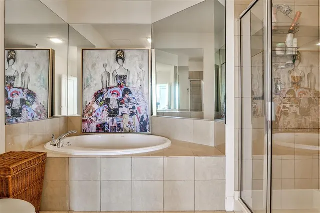 a bathroom with a bathtub and shower