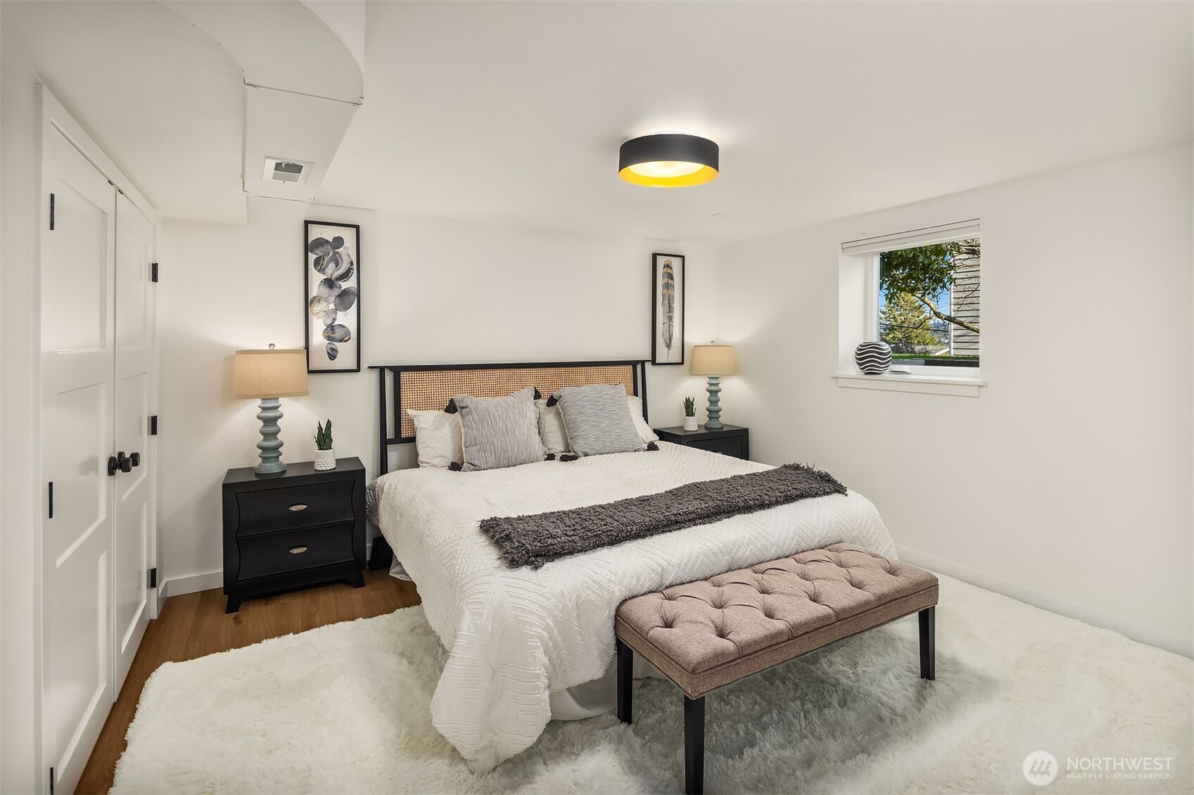 349 North 72nd Street Seattle, WA 98103 - Photo 14 of 26 a bedroom with a bed and a lamp