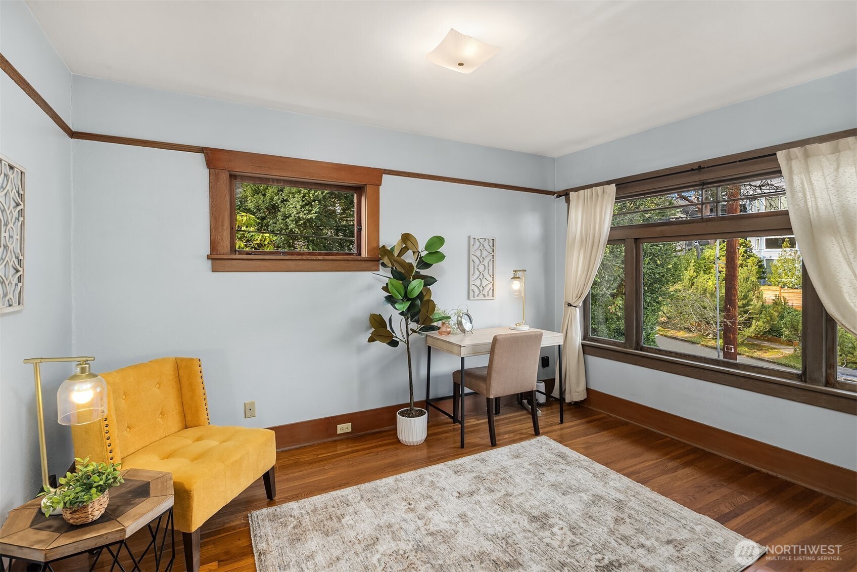349 North 72nd Street Seattle, WA 98103 - Photo 18 of 26 a living room with furniture and a window