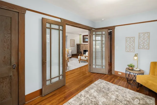 a bedroom with furniture and a wooden floor