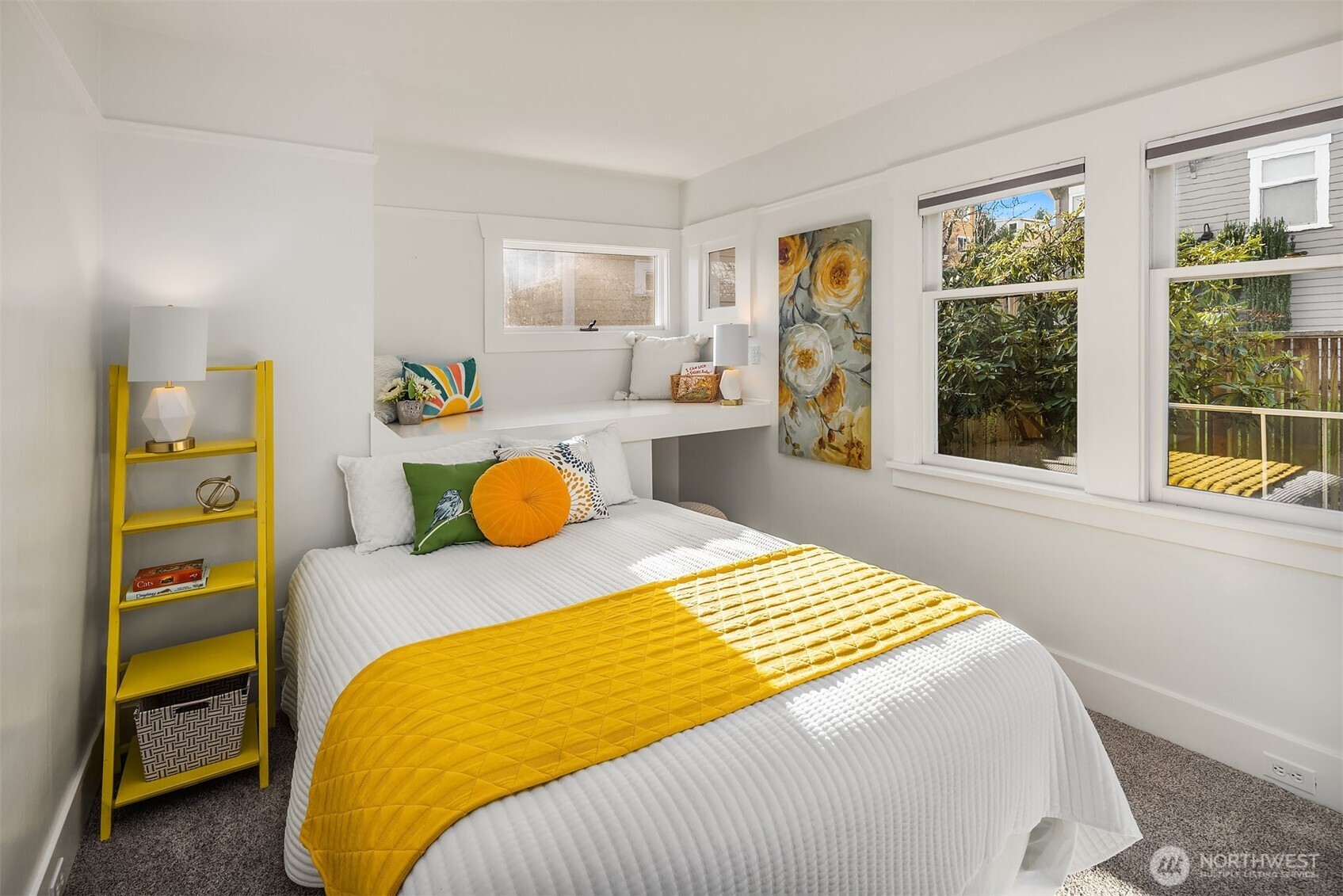 349 North 72nd Street Seattle, WA 98103 - Photo 20 of 26 a bedroom with a bed and wooden floor