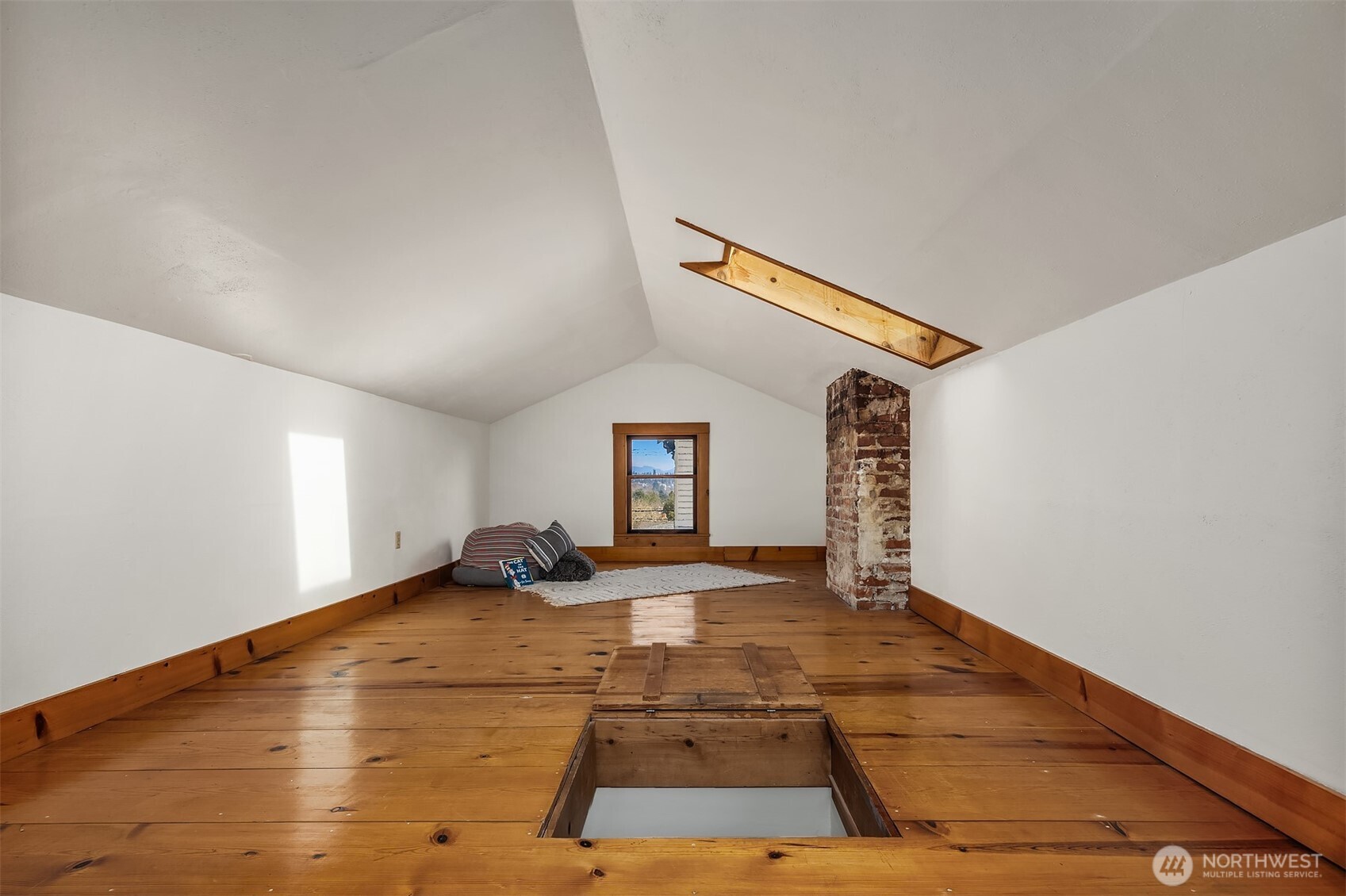 349 North 72nd Street Seattle, WA 98103 - Photo 23 of 26 a room with a bed and a night stand