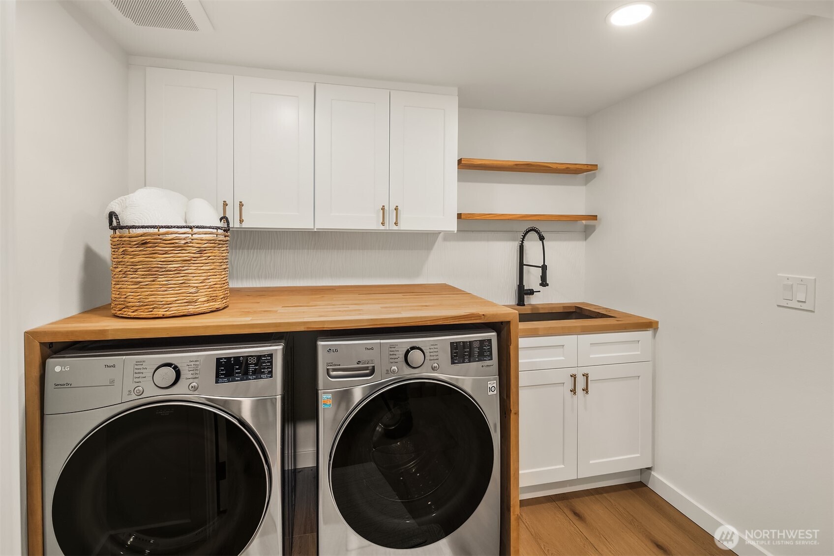 349 North 72nd Street Seattle, WA 98103 - Photo 24 of 26 a utility room with sink dryer and washer