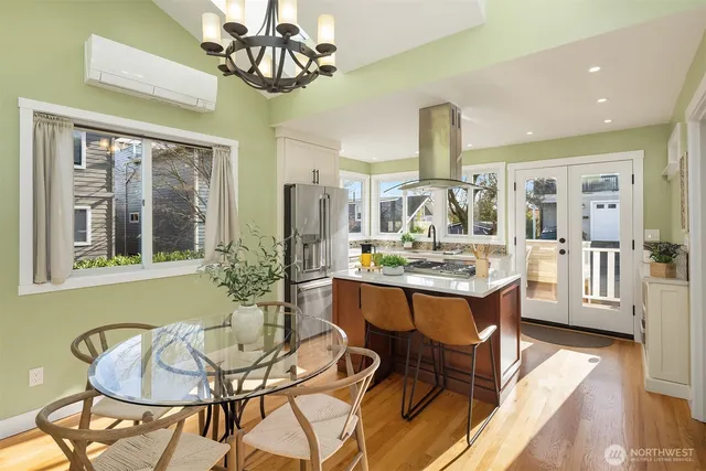 a view of a dining room with furniture window and wooden floor