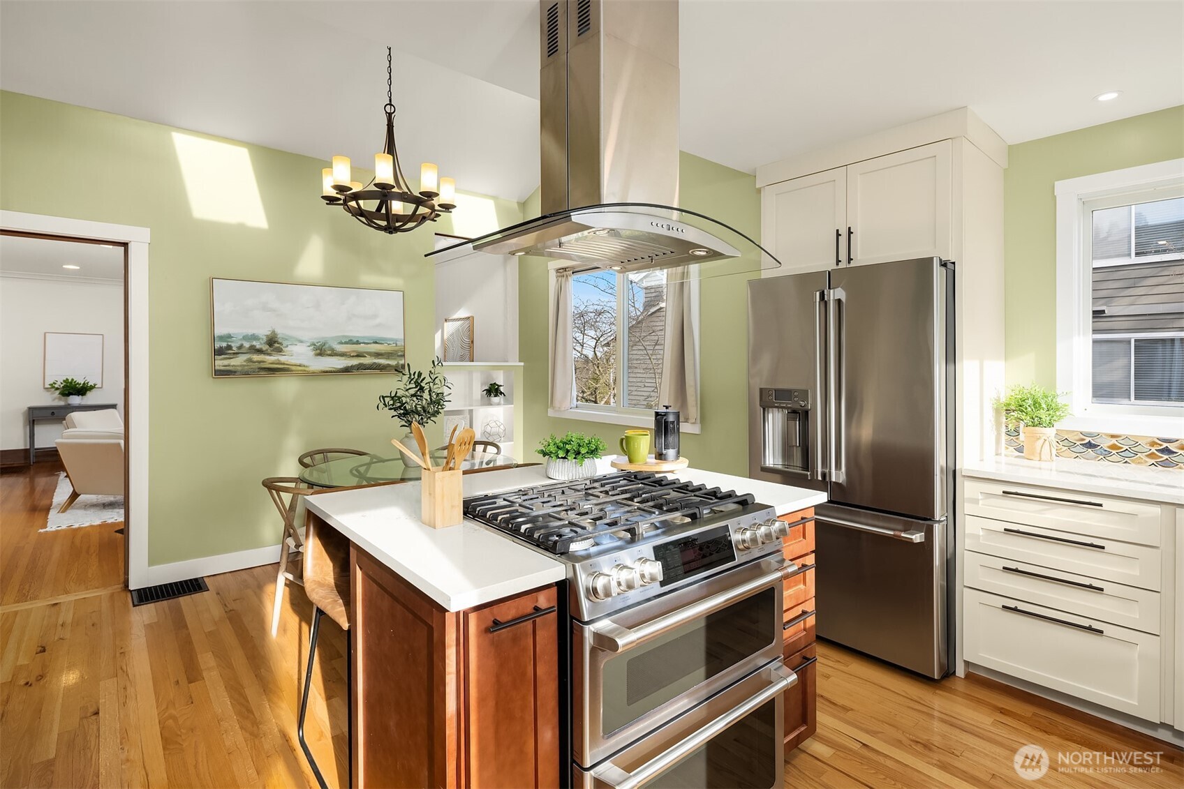 349 North 72nd Street Seattle, WA 98103 - Photo 7 of 26 a kitchen with stainless steel appliances granite countertop a refrigerator and a stove top oven