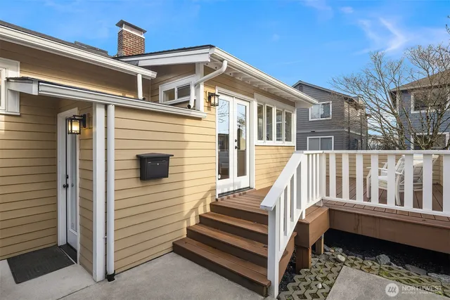 a view of a house with wooden fence