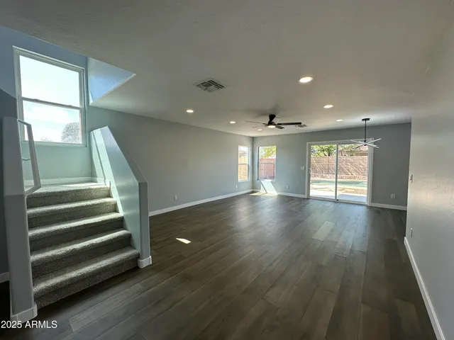 a view of a kitchen with a sink and a refrigerator