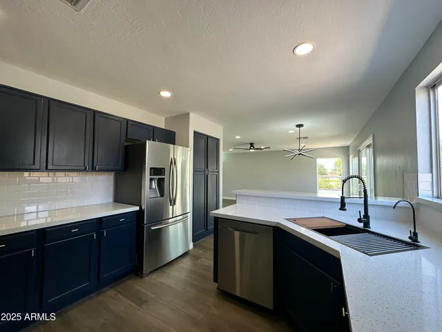 a bathroom with a sink a mirror and shower