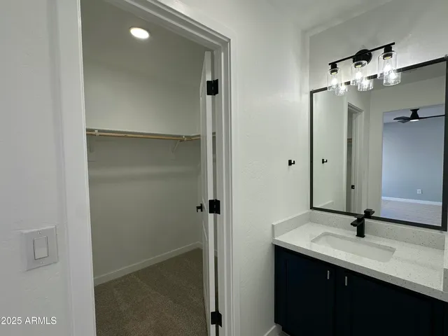 a bathroom with a shower and a sink