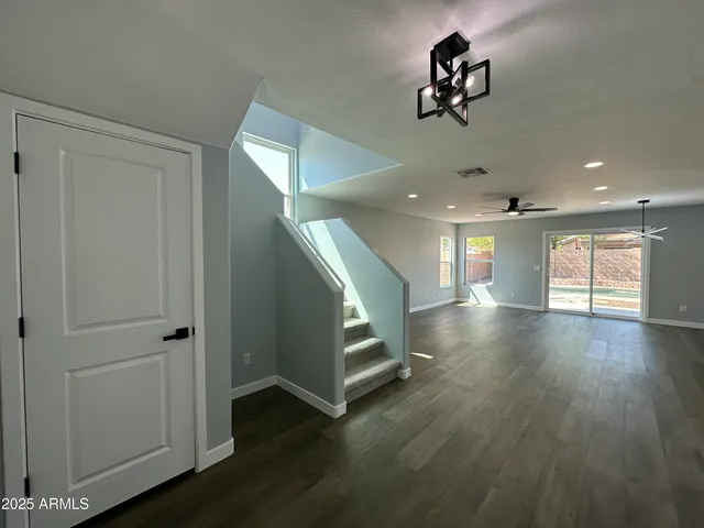 a view of walk in closet with wooden floor