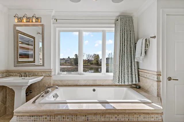 a bedroom with a bed and a desk