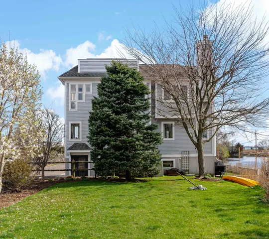 a brick building with a yard in front of it