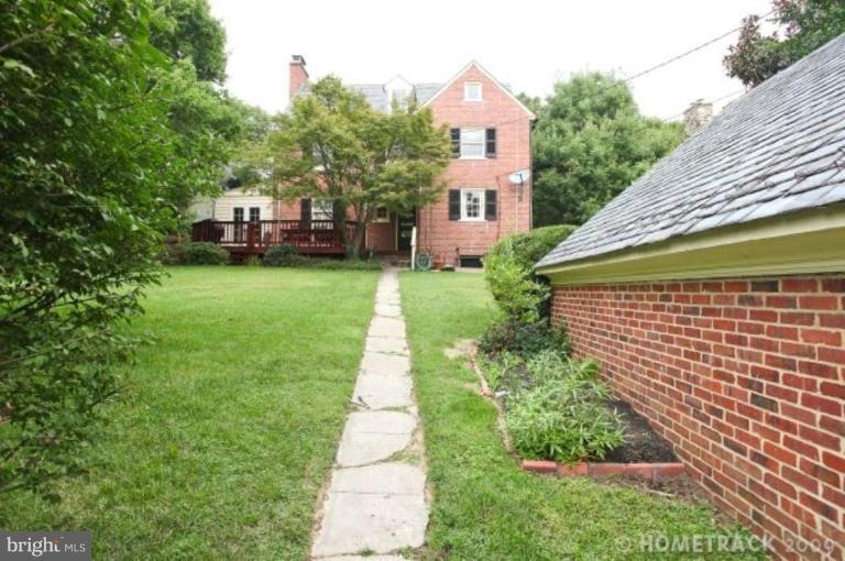 221 Tunbridge Road Baltimore, MD 21212 - Photo 3 of 14 a front view of a house with a yard and trees