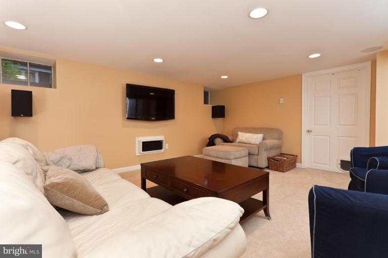 221 Tunbridge Road Baltimore, MD 21212 - Photo 10 of 14 a living room with furniture and a flat screen tv