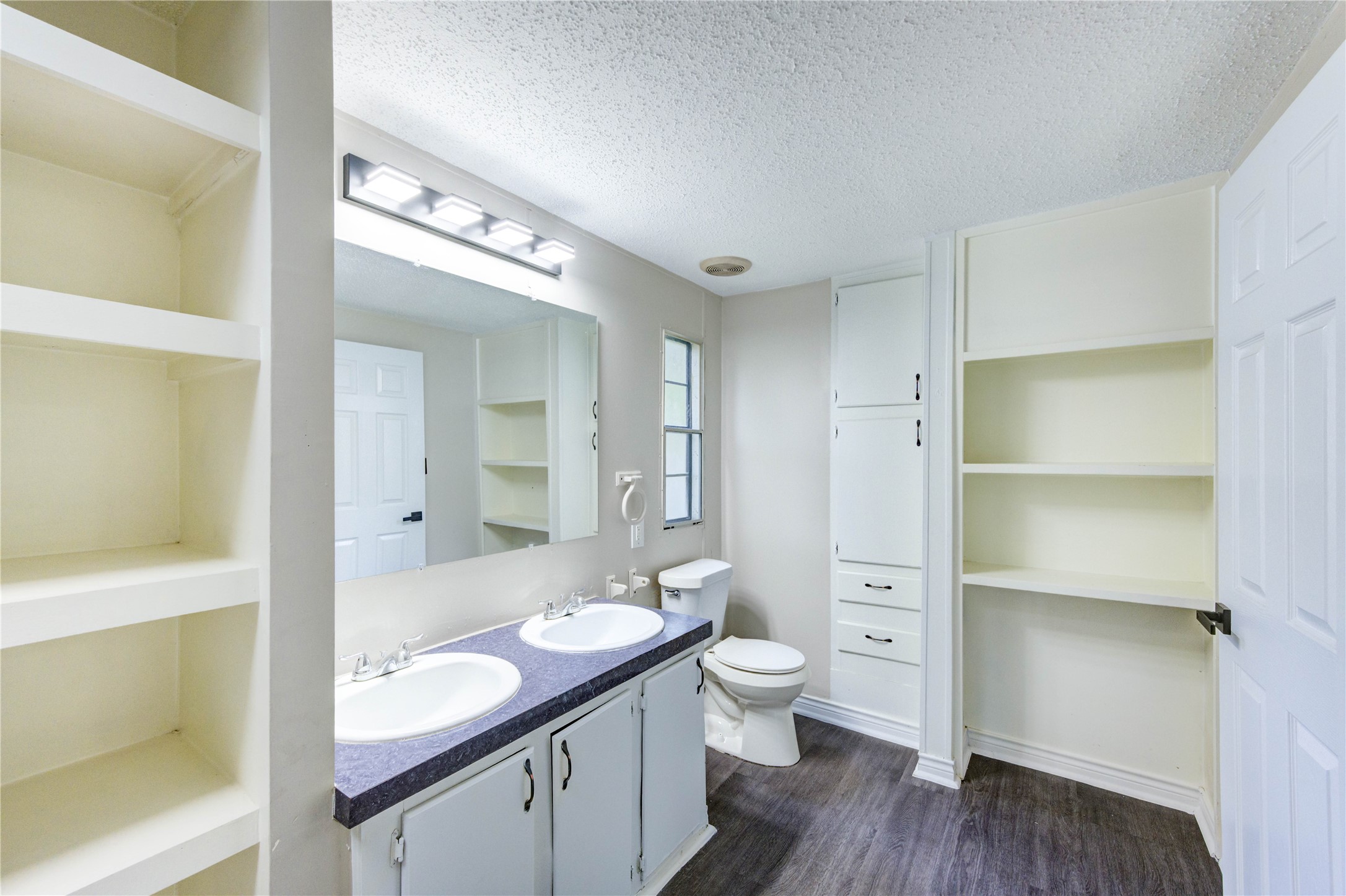 26342 Hunters Trail New Caney, TX 77357 - Photo 14 of 25 a bathroom with a granite countertop sink toilet and shower