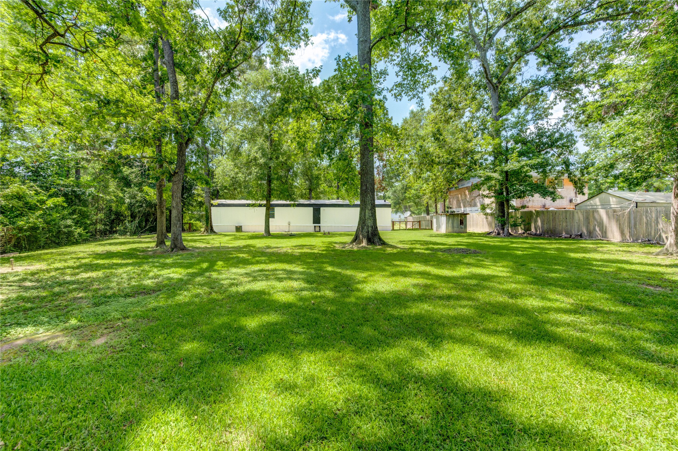 26342 Hunters Trail New Caney, TX 77357 - Photo 21 of 25 a view of a park with large trees