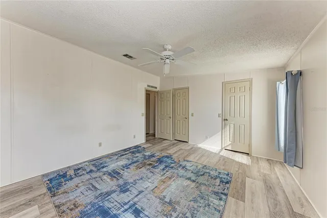 a spacious bathroom with a granite countertop sink mirror and double