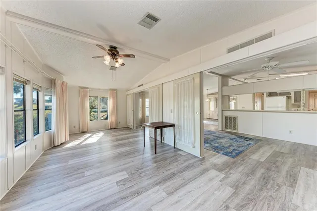 a room with lots of appliances and chandelier