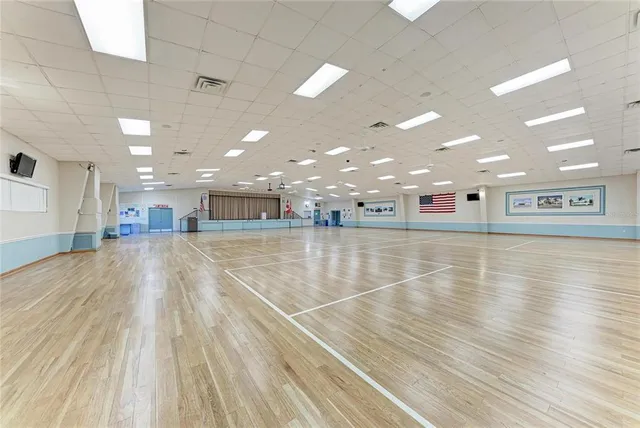 a room with gym equipment and white walls