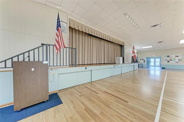 a utility room with multiple dryer and washer