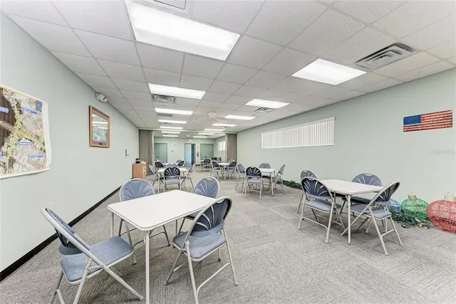 a room with lots of furniture and wooden floors