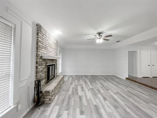 a kitchen with a sink a stove a microwave and cabinets