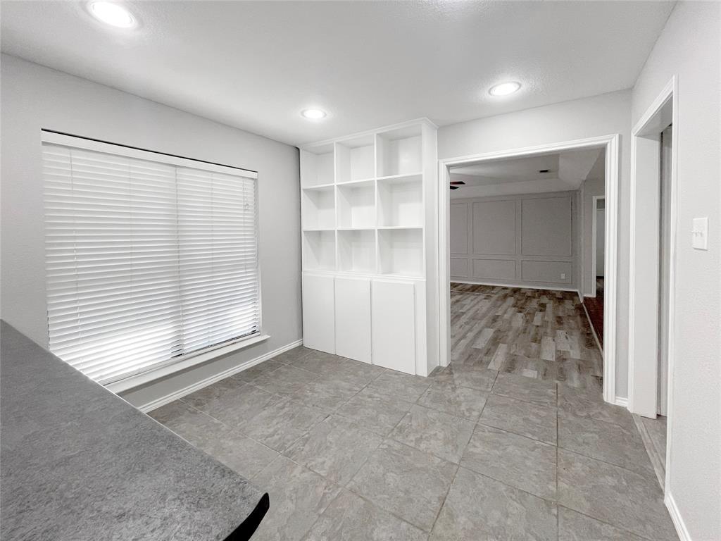 7716 Harmony Drive Fort Worth, TX 76133 - Photo 18 of 40 an empty room with a empty space and windows