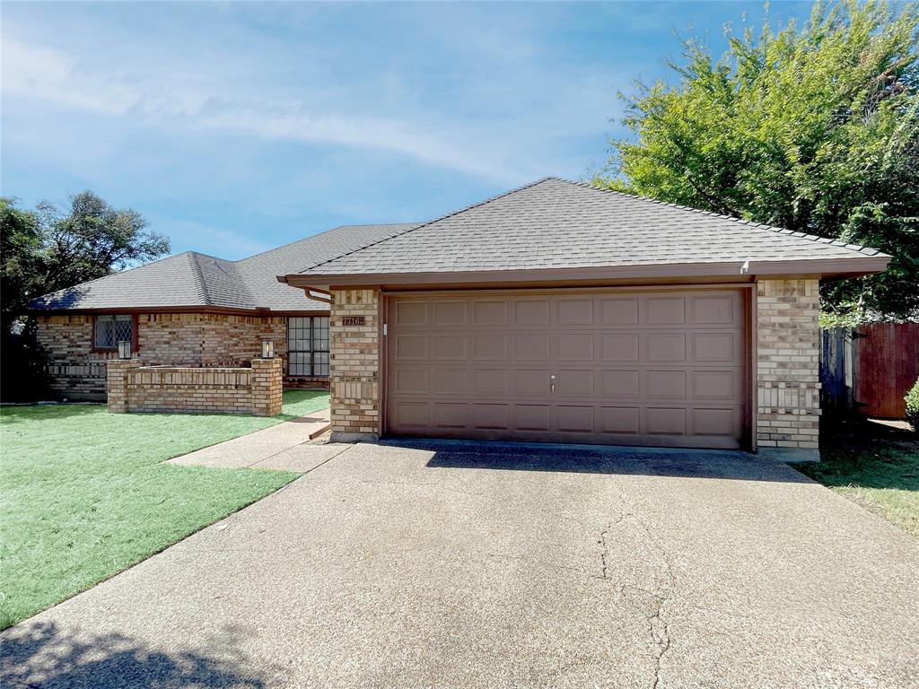 7716 Harmony Drive Fort Worth, TX 76133 - Photo 2 of 40 a front view of a house with a yard and garage
