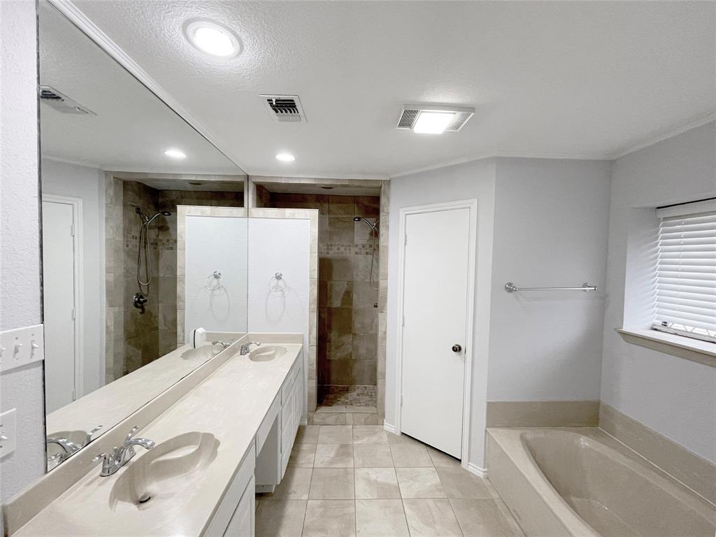 7716 Harmony Drive Fort Worth, TX 76133 - Photo 29 of 40 a bathroom with a sink and a mirror