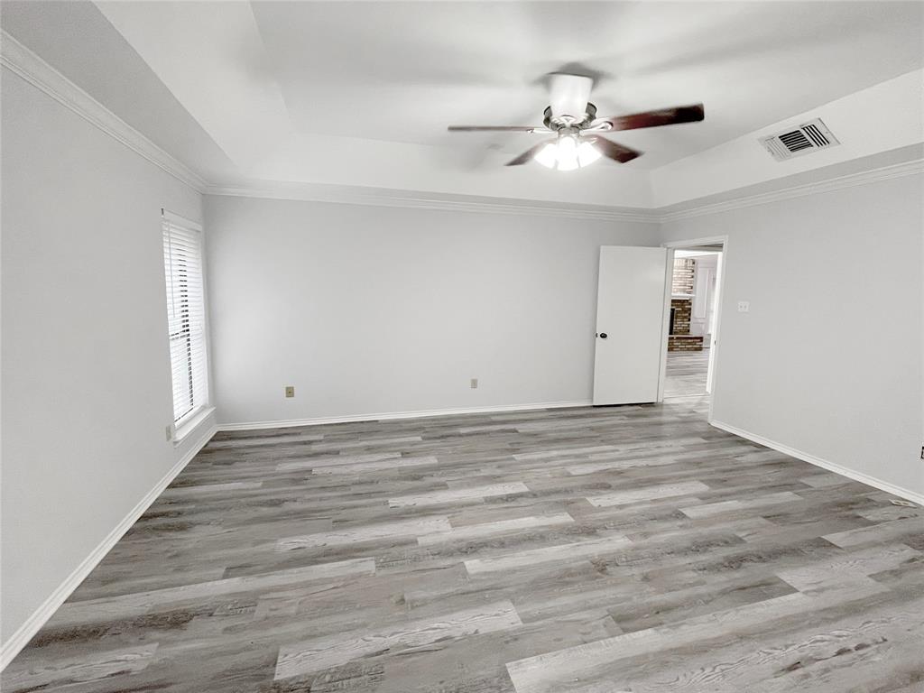 7716 Harmony Drive Fort Worth, TX 76133 - Photo 32 of 40 a view of empty room with wooden floor