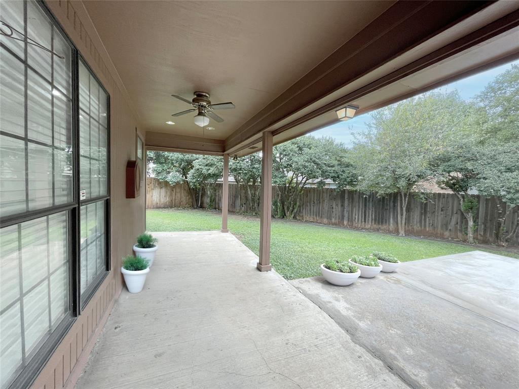 7716 Harmony Drive Fort Worth, TX 76133 - Photo 34 of 40 a view of a house with backyard and porch
