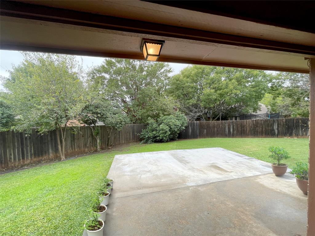 7716 Harmony Drive Fort Worth, TX 76133 - Photo 35 of 40 a view of a backyard with a lake view