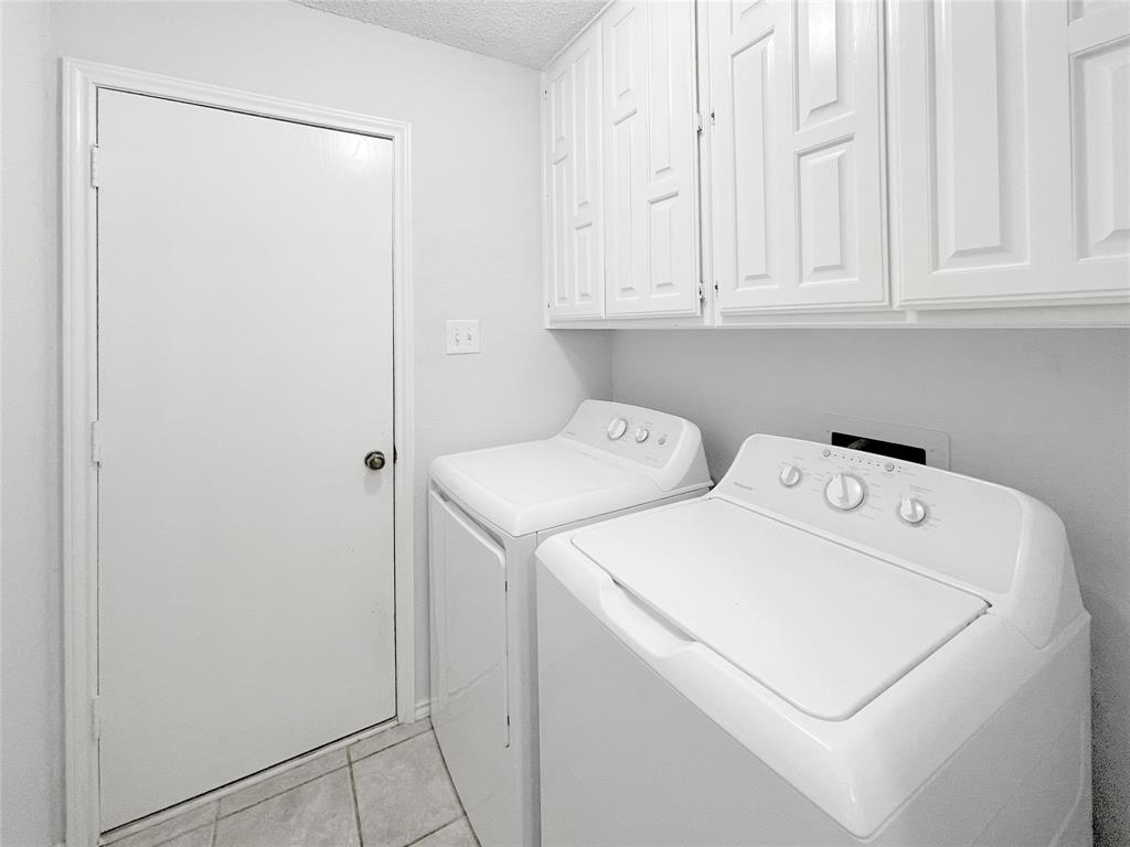 7716 Harmony Drive Fort Worth, TX 76133 - Photo 38 of 40 a utility room with dryer and washer