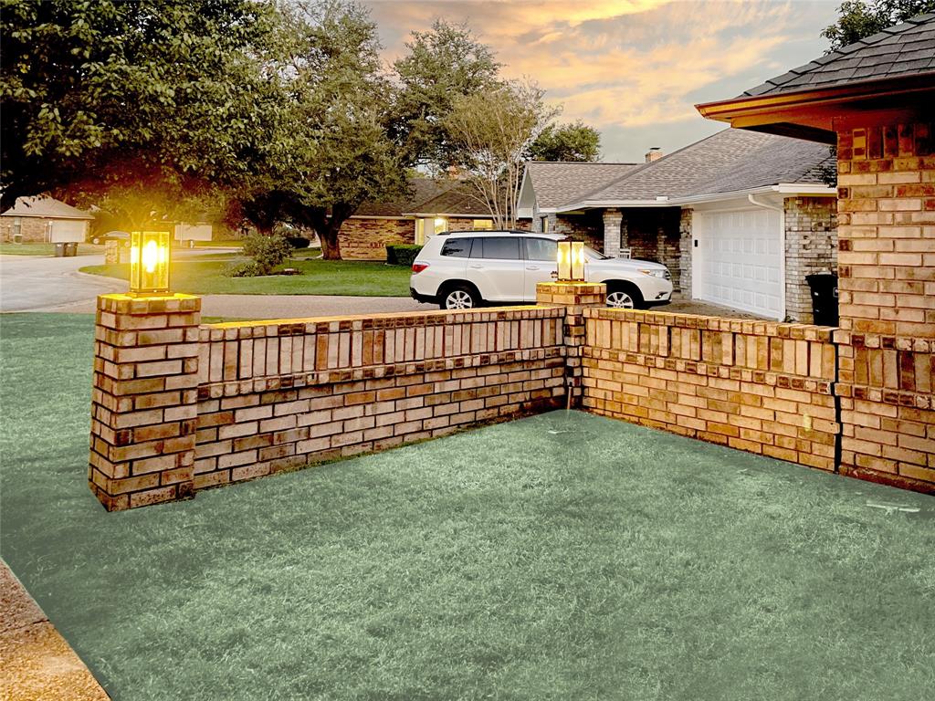 7716 Harmony Drive Fort Worth, TX 76133 - Photo 39 of 40 a view of a porch with a yard