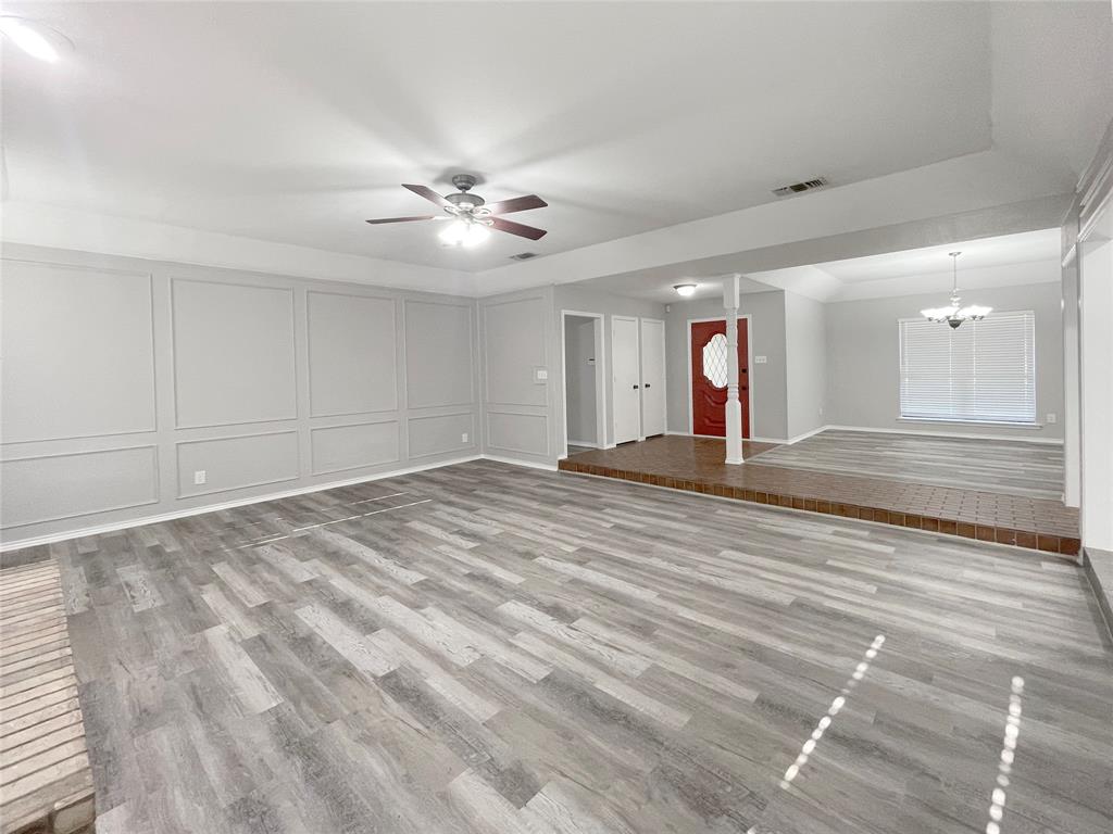 7716 Harmony Drive Fort Worth, TX 76133 - Photo 5 of 40 a view of empty room with wooden floor