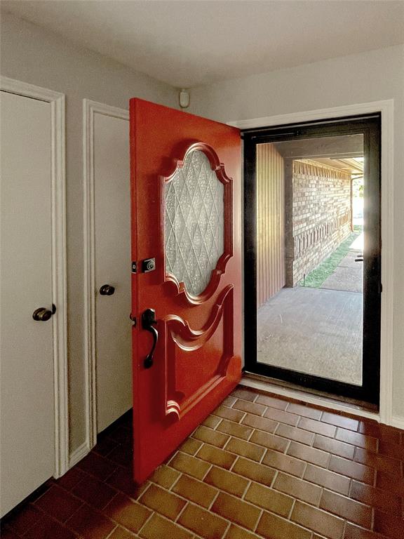 7716 Harmony Drive Fort Worth, TX 76133 - Photo 6 of 40 a view of a room with window wooden floor and door