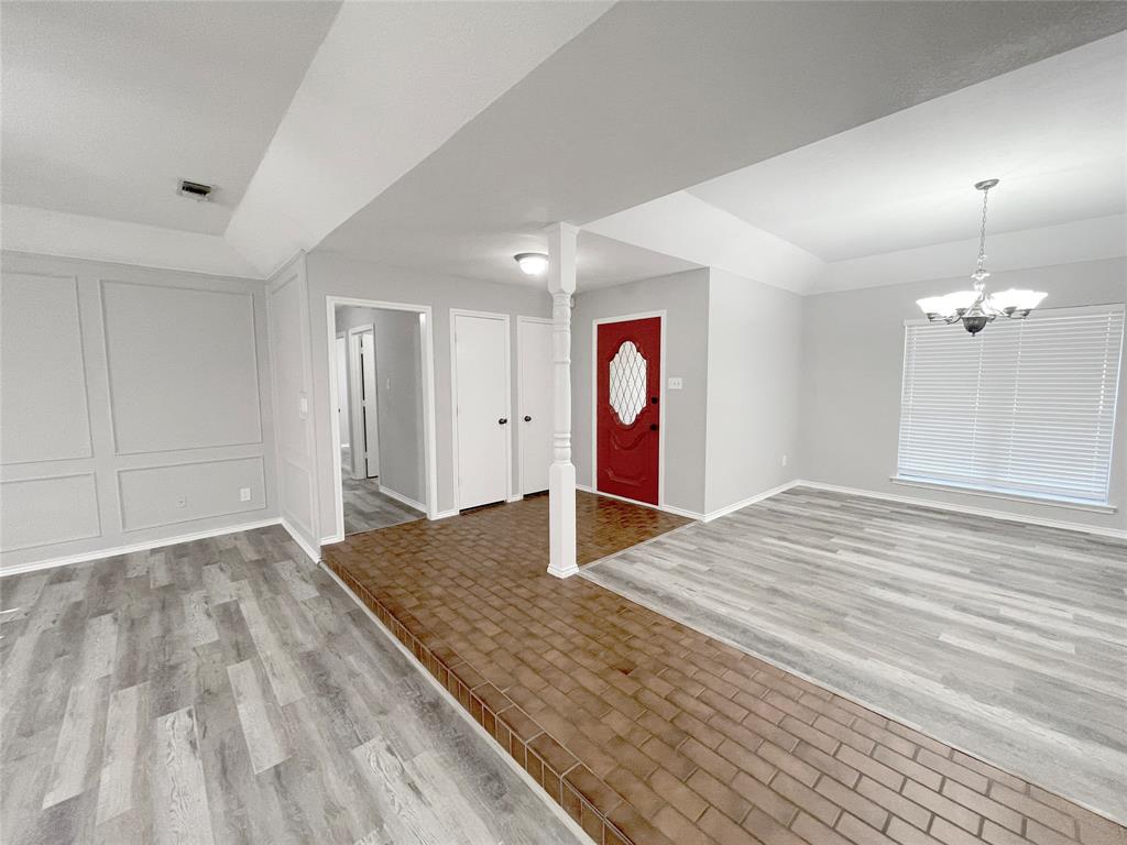 7716 Harmony Drive Fort Worth, TX 76133 - Photo 8 of 40 a bedroom with a bed and a dresser