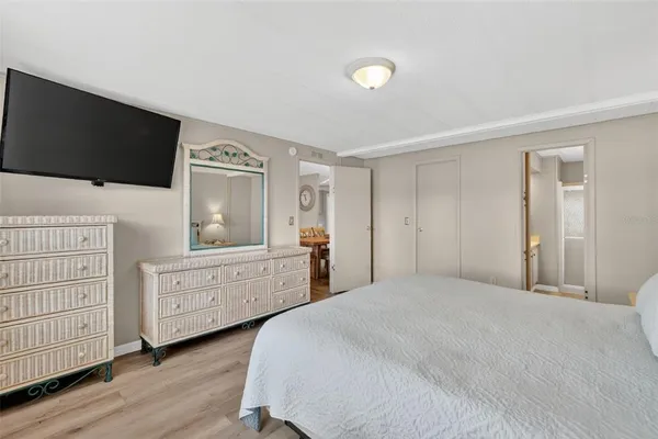a bedroom with a bed and a dresser