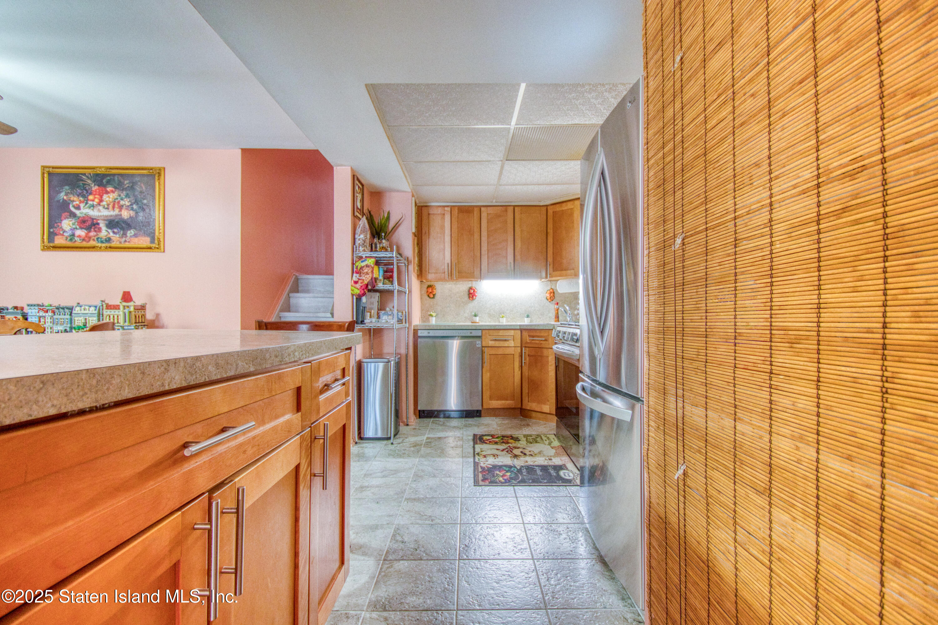 52 Racal Court, Unit A2 Staten Island, NY 10314 - Photo 17 of 28 a kitchen with stainless steel appliances a refrigerator and a stove