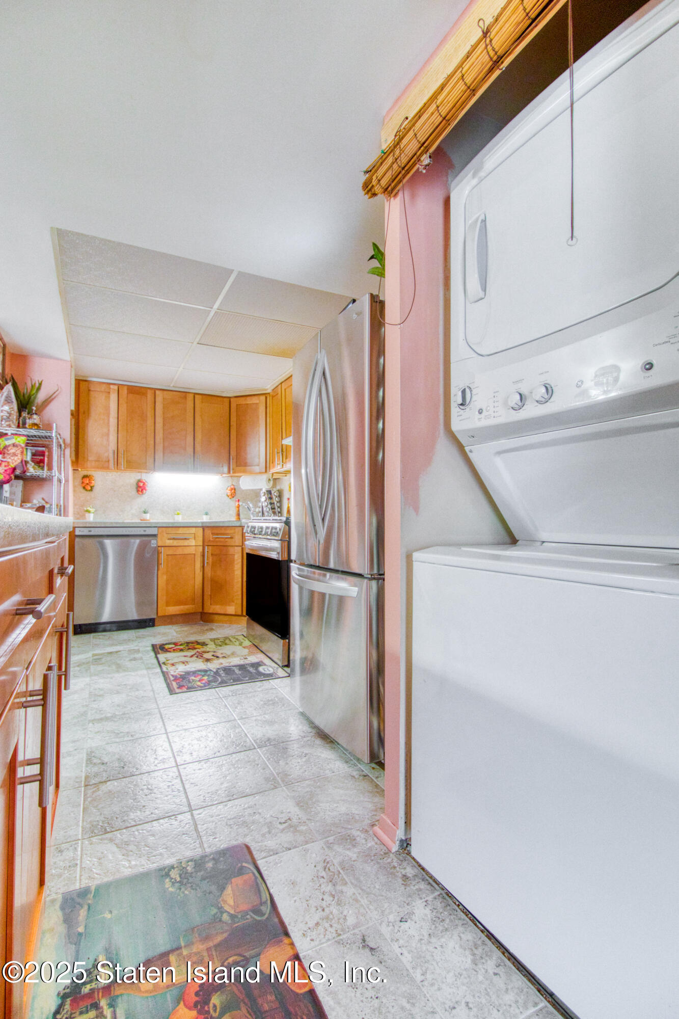 52 Racal Court, Unit A2 Staten Island, NY 10314 - Photo 18 of 28 a view of a kitchen with a sink and an empty room
