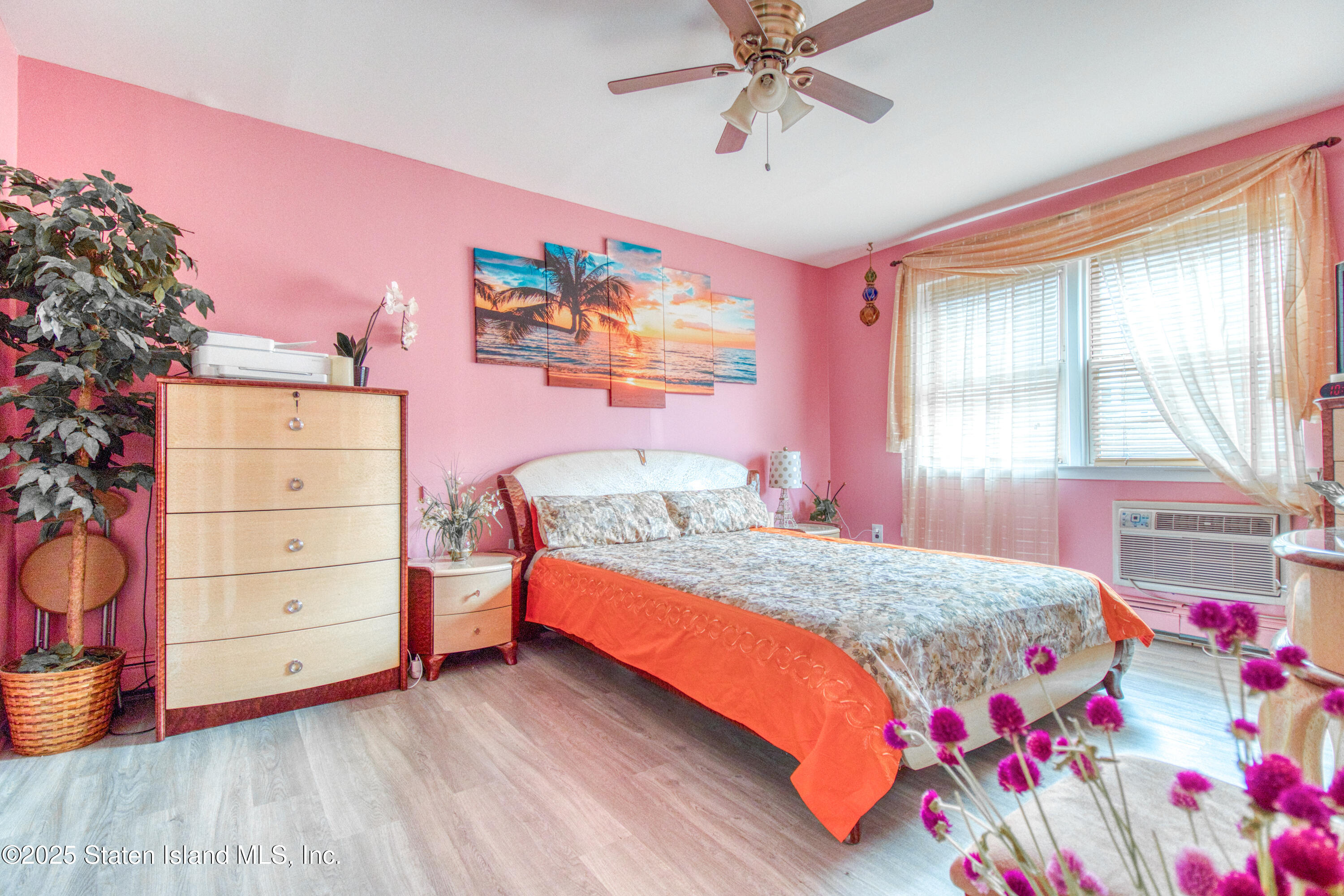 52 Racal Court, Unit A2 Staten Island, NY 10314 - Photo 19 of 28 a bedroom with a bed and a window