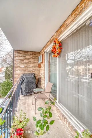 a balcony view with a potted plant